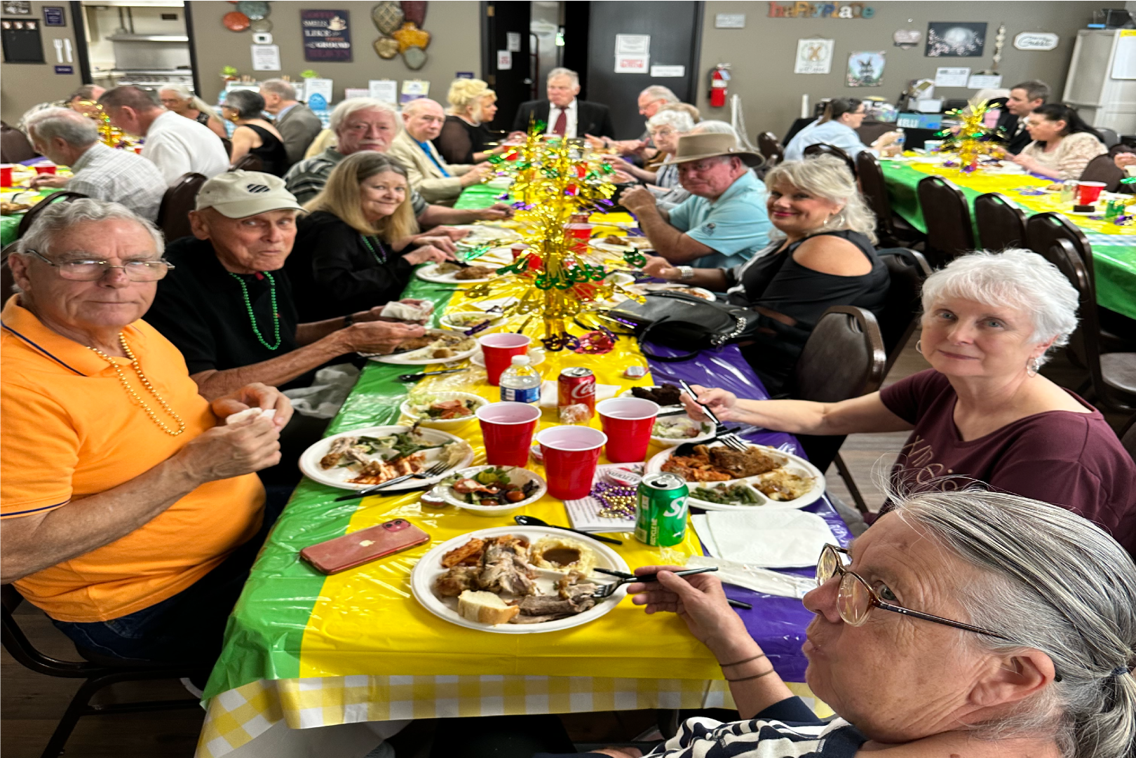 Group of people eating food at the Senior Center