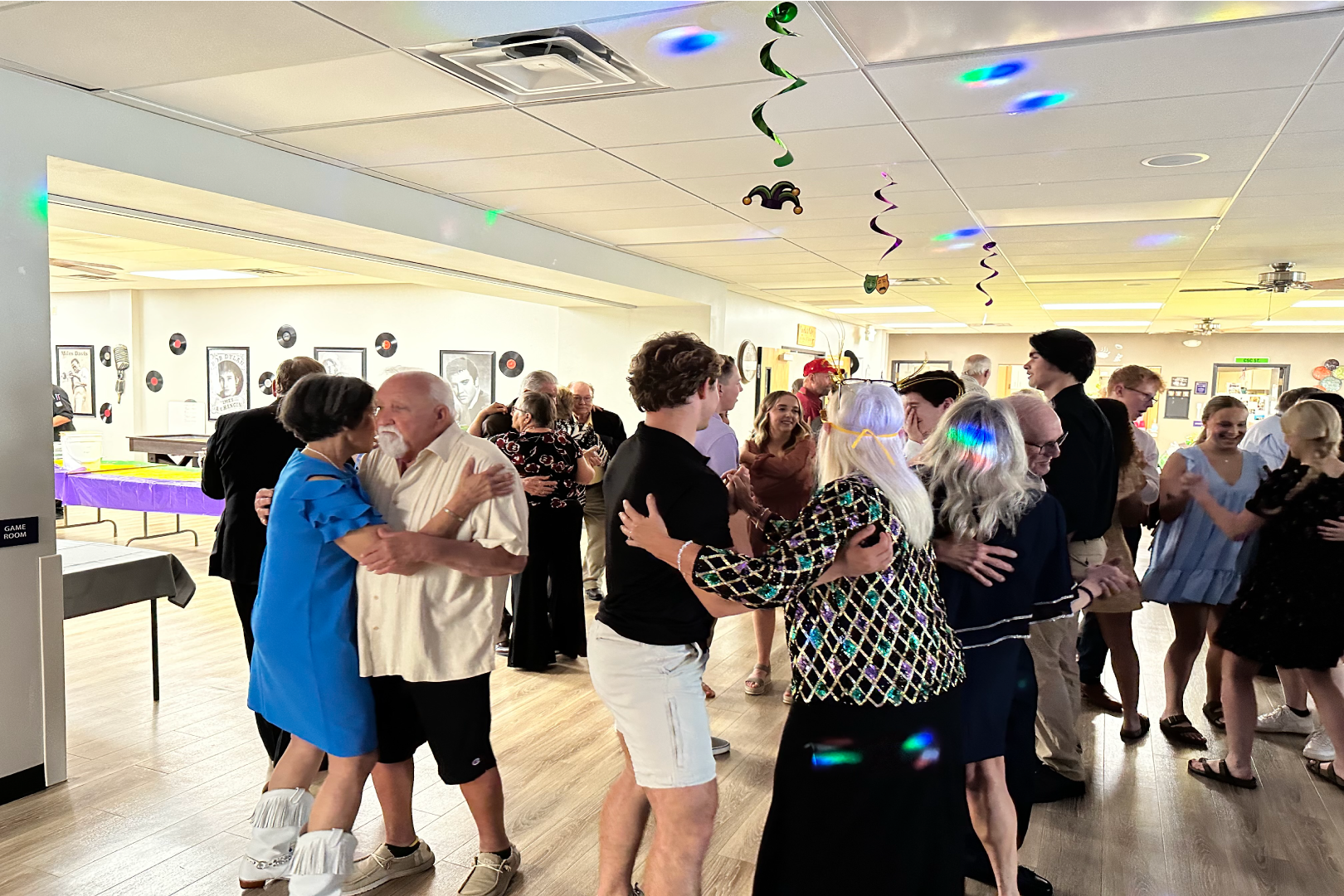 Group of men and women dancing at the Senior Center
