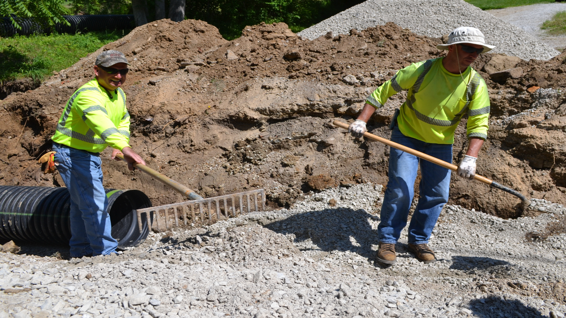 Picture of two men digging a hole