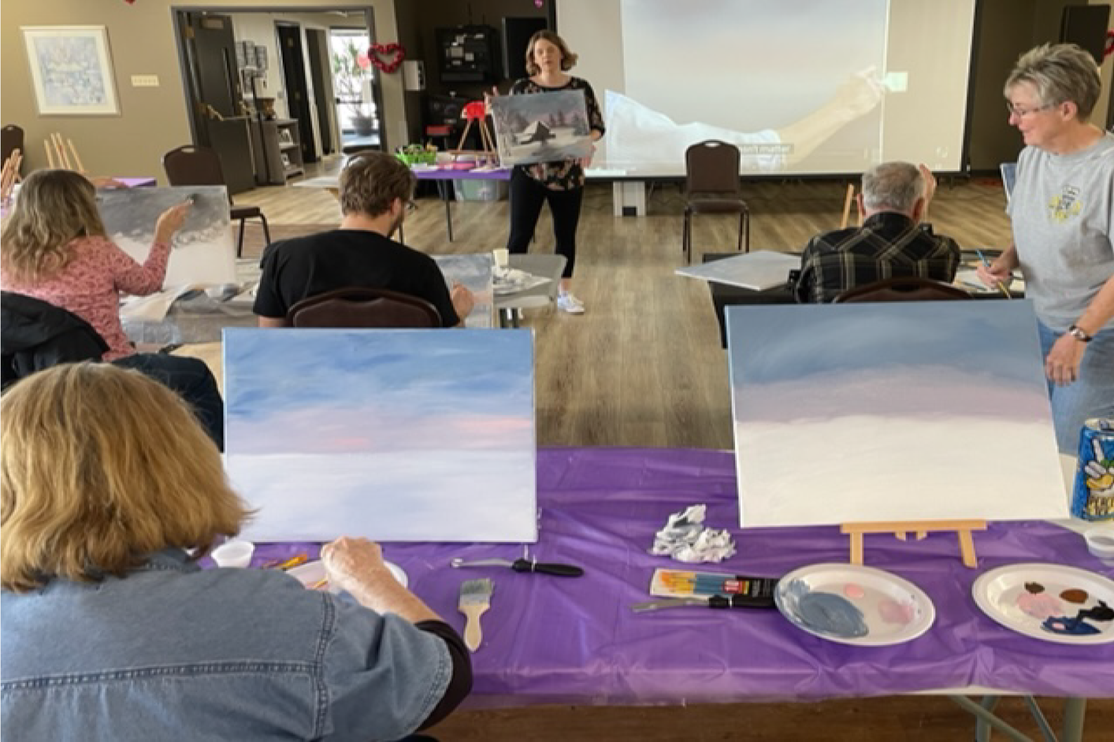 Picture of a group of people painting at the Senior Center