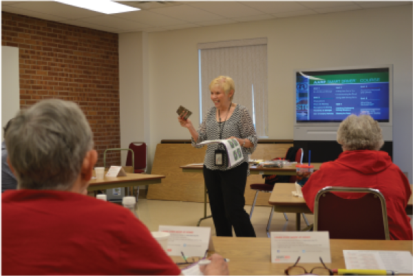 Picture of a woman teaching a class at the Senior Center